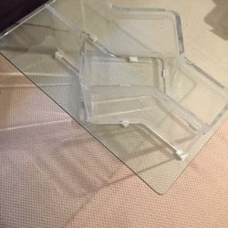 Glass coffee table with lucite base 