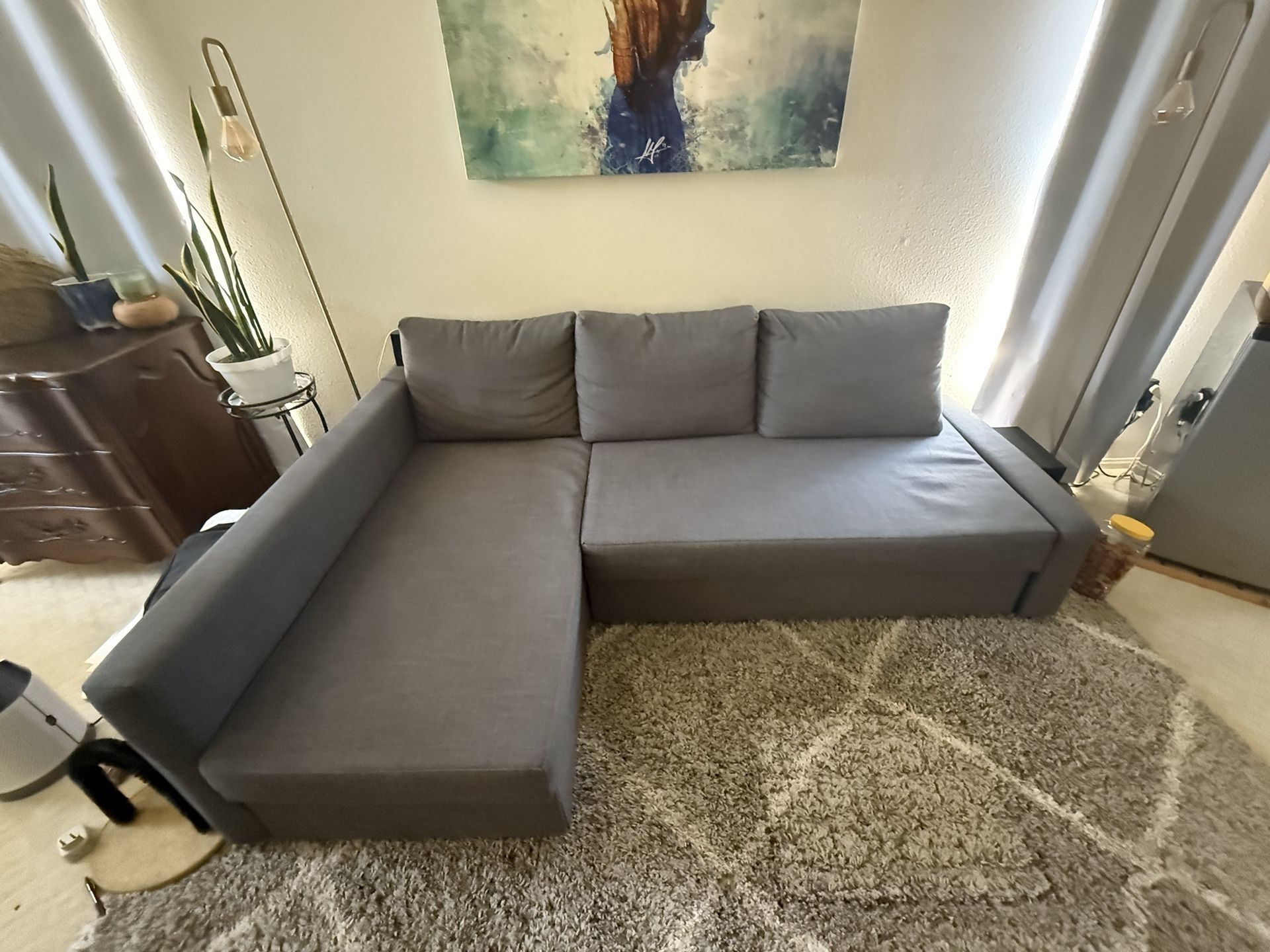 L-Shaped Couch With Storage And Pull-out Section