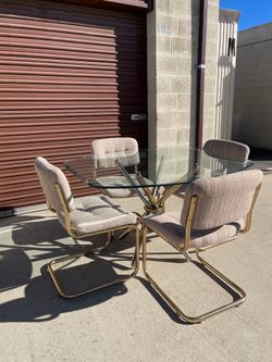 1980s Vintage postmodern knot dining table tubular brass and glass dining set