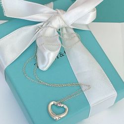 Tiffany & Co. Elsa Peretti Open Heart Pendant in Silver with Pink Sapphire 17.5”