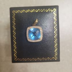 Maui Divers 14 K Gold Blue Topaz And Diamonds Pendant.  Weight Is 3.2 Grams