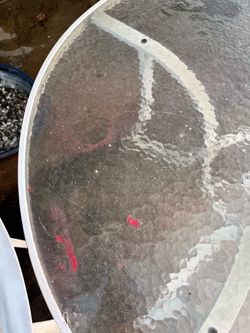 Round glass patio table