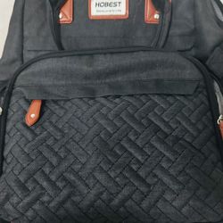 Diaper bag with diaper changing station