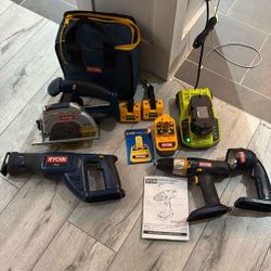 (4) Ryobi 18.0 V Cordless Products, P510 Saw, P201 1/2” Drill, P700 Flashlight, And P500 Circular Saw, One + Charging Stations, 2 18 V Batteries, Bag