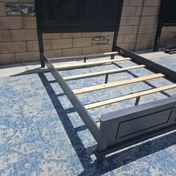 Gray panel bed frame from the Ashley Furniture Lanolee collection