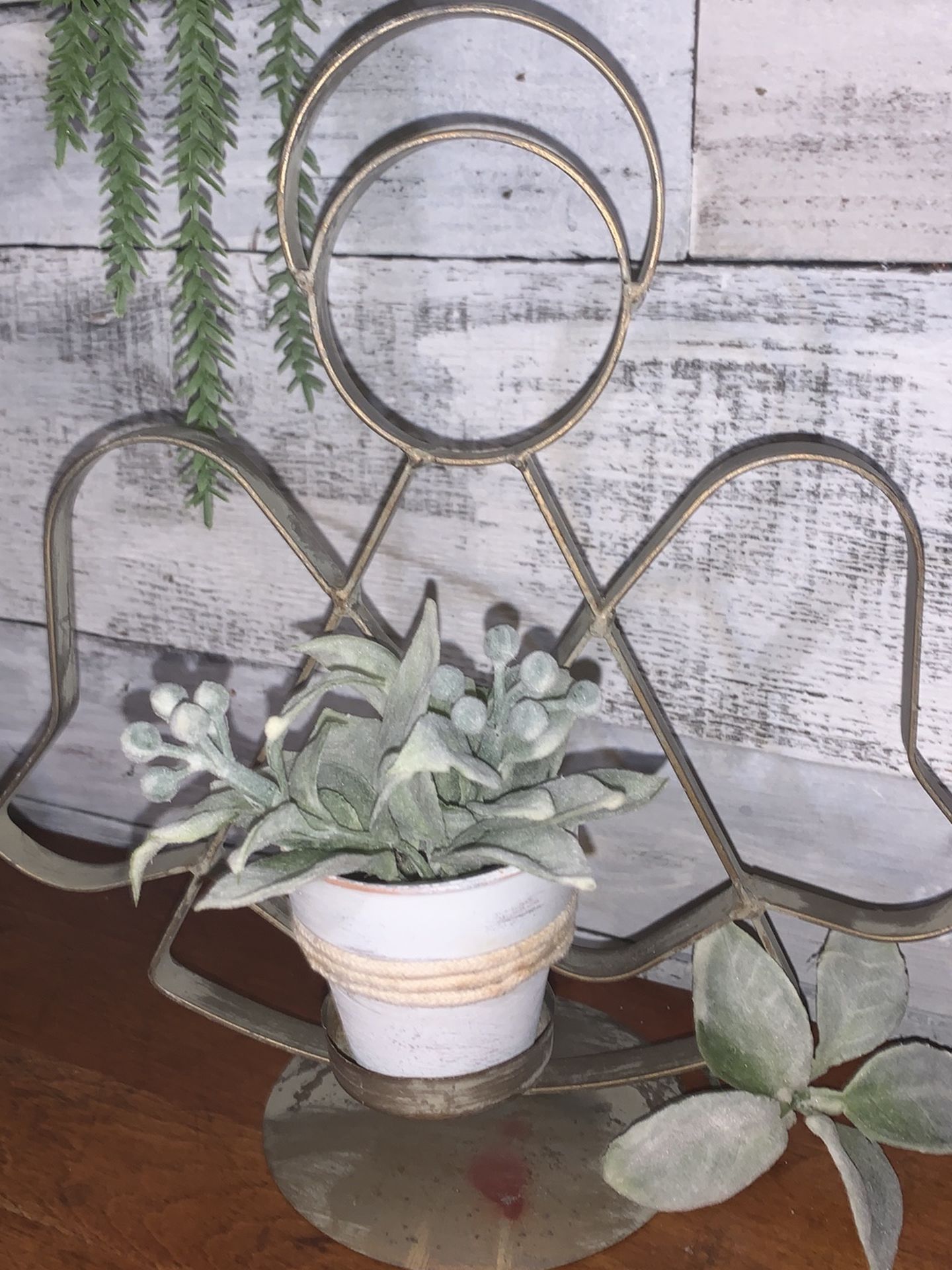 Metal angel candle holder with mini painted pot and floral