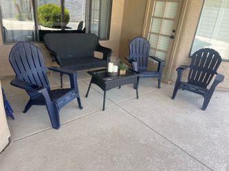 3 navy Adirondack chairs