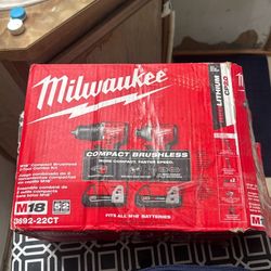 Milwaukee M18 and and 18V Brushless Cordless Compact Drill/ Impact Combo Kit and battery 5,0 used like new