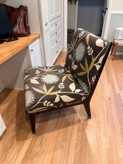 Upholstered chair for living area