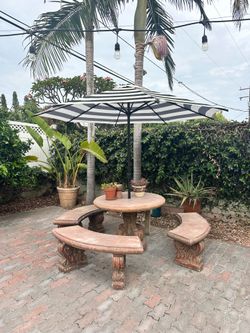 Outdoor stone table with benches