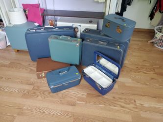 Assorted vintage luggage