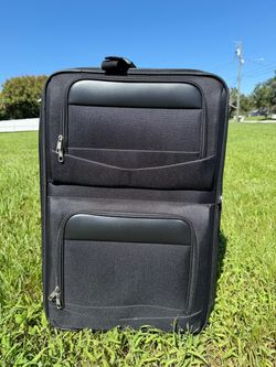 Soft carry on suitcase with small bag.