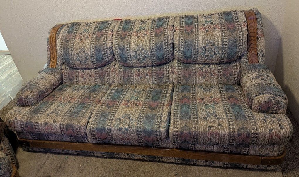 Two Couches And Table With 6 Rolling Chairs