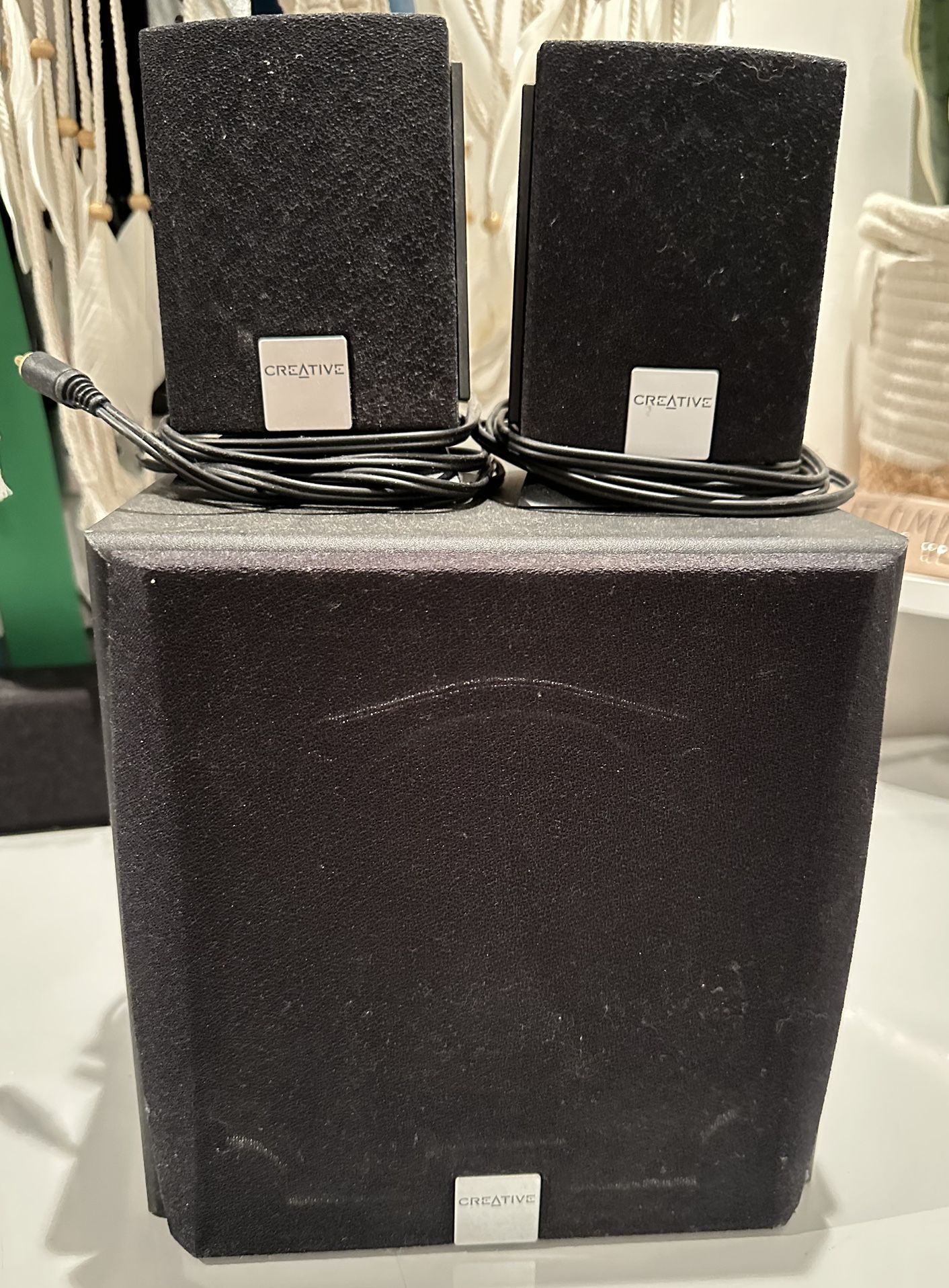 Creative brand 2.1 speaker system - two small satellite speakers and one subwoofer. Creative is well-known for making compute