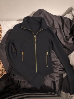Black Lululemon jacket with gold zippers