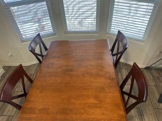 New condition Lazy Boy Dining room table and chairs