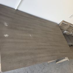 Dining table with four chairs and bench