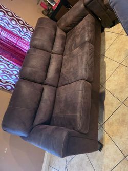 2 brown sofas