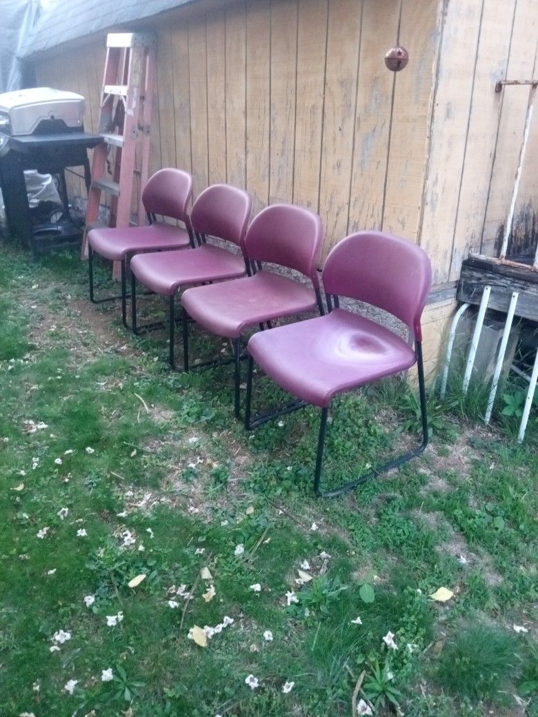 4 Metal And Plastic Easy Stack Chairs.