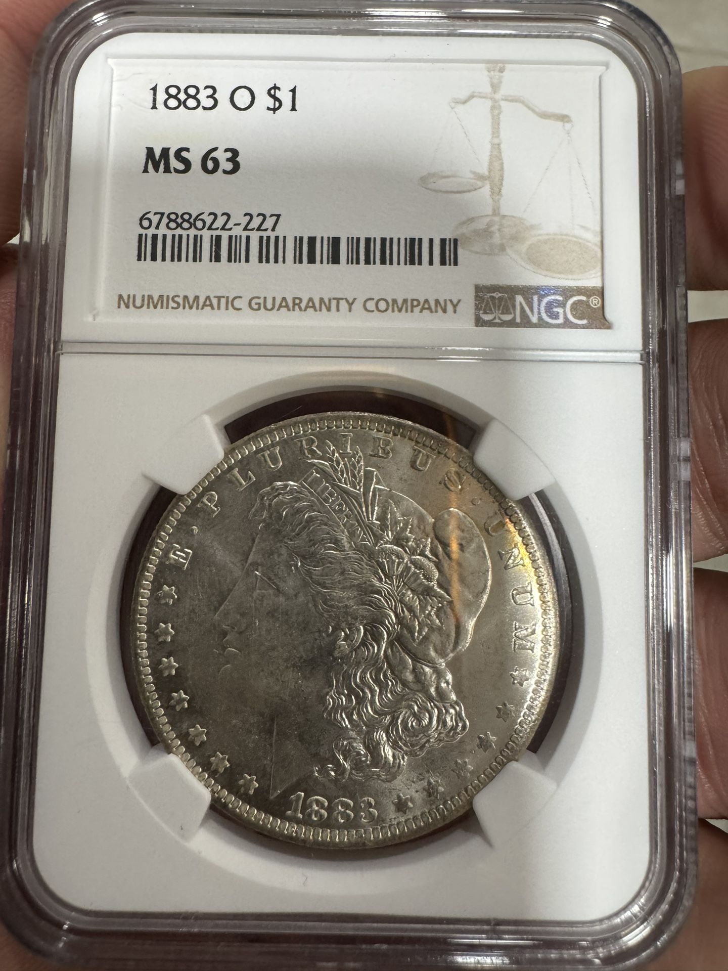 1883 O $1 Morgan MS63
