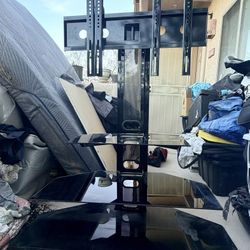 Modern TV stand with adjustable swivel TV mount and glass shelves 