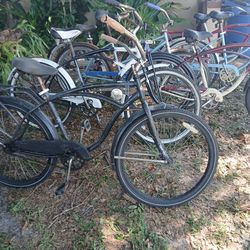 7 beach cruiser the white one Schwinn beach cruiser from 1947 it holds air the black bike holds air  sell as  is