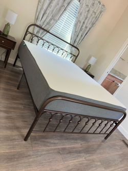 Bronze Metal Qween Bed Frame with mattress.