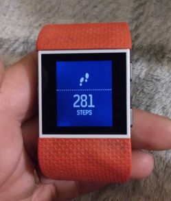 Fitbit Surge and charging station