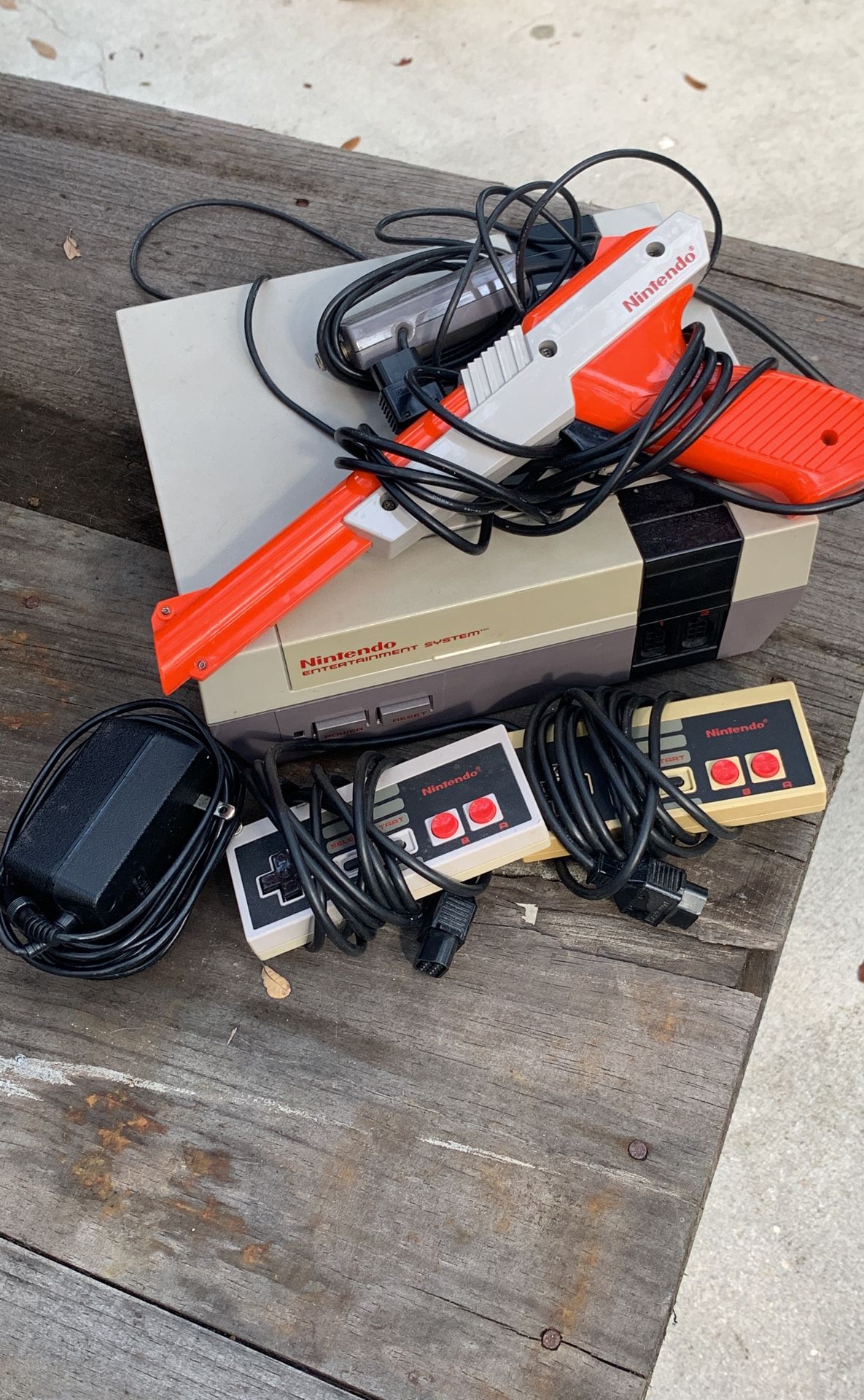 Original Nintendo system with 2 controllers, gun, and 5 games