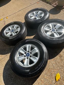17" Ford F-150 wheels, good tires, centercaps