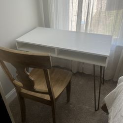white desk and wooden chair 
