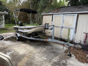 12ft J12 skiff with motor and trailer