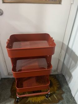 Three tier orange metal rolling cart