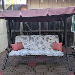 Patio swing with seats and cushions