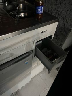 Small fridge, portable kitchen… etc