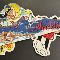 Vintage Disney Foam banners pair. Aladdin & Minnie Mouse. Aladdin is 25” X 10”. Minnie Mouse Walt Disney World on Ice 12” X 19”. Some light staining &