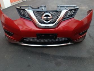 2014 2016 Nissan Rogue complete front bumper with Grill with emblem and all the accessories oem.