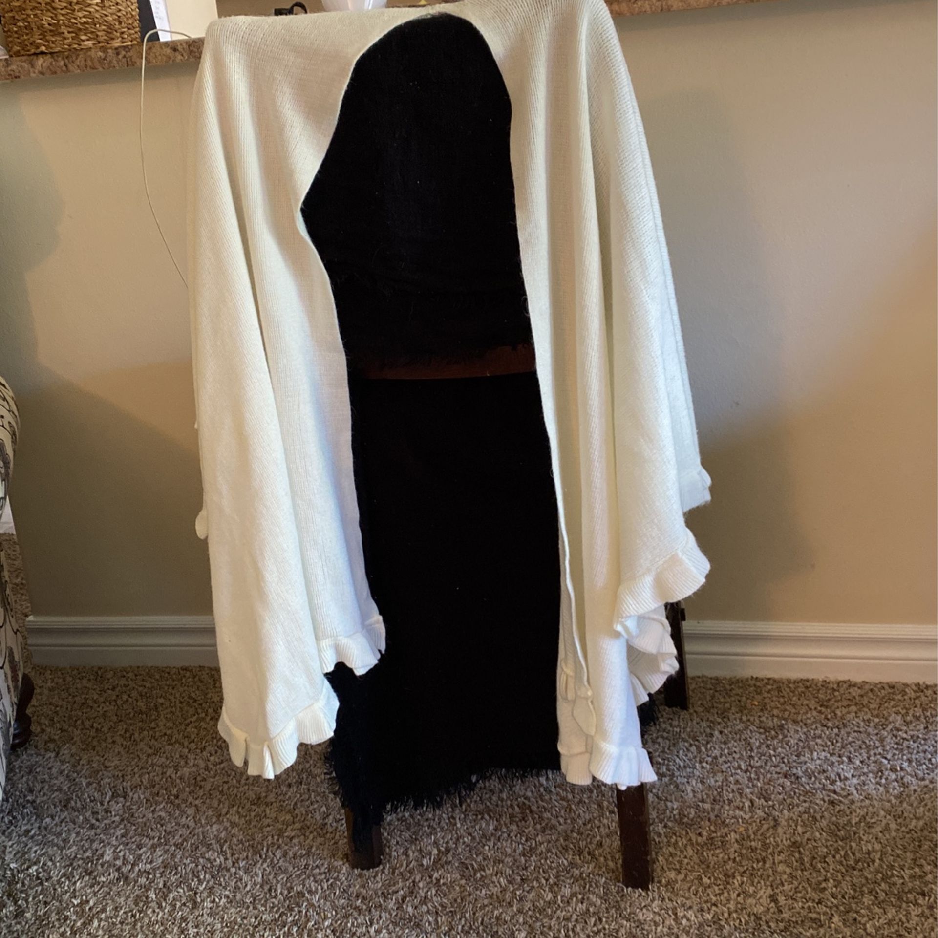 White Shawl With Ruffles On The Bottom Edges