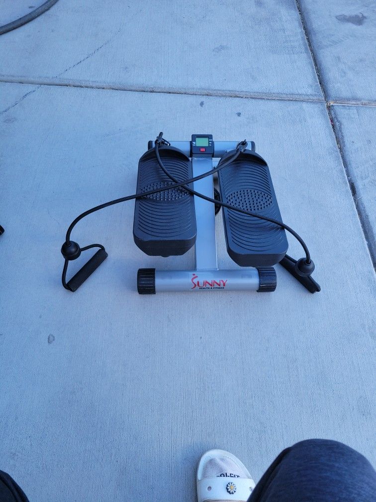 Elliptical machine under desk