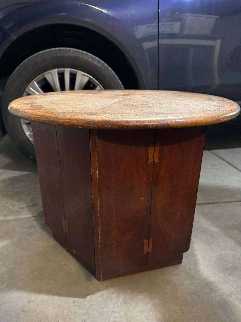 Round End Table With Hexagon Storage Base.