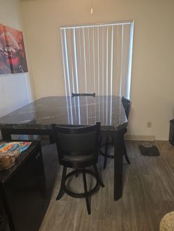 Marble table with 3 barstool chairs