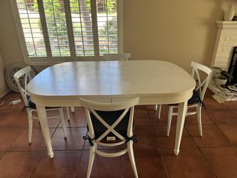 Dining room table and chair with extention leaf.