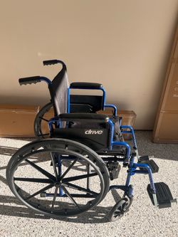 Drive Medical Blue Streak Lightweight Wheelchair, Footrests, 16" Seat + Additional cushion for $20