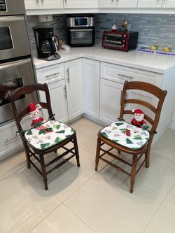 Two vintage wooden chairs, Merry Christmas themed
