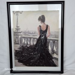 Elegant Lady In a Beautiful Black Evening  Gown  looking  over a Balcony  in Paris.