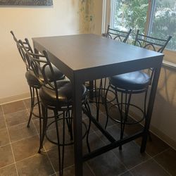 Bar Height Table And 4 Swivel Chairs