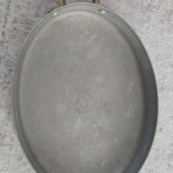 “Vintage copper-bottom pan with brass handles