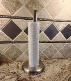 NEW IN BOX. VERY NICE & HEAVY PAPER TOWEL 🧻 HOLDER. You Don't Have Worry About Pulling A Piece Off & It Falling Over. See Photos. Cash& Pickup Only