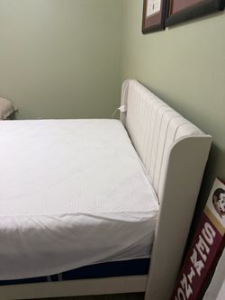 For sale Queen upholstered  bed frame . Mattress not included