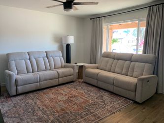 Two power reclining sofas